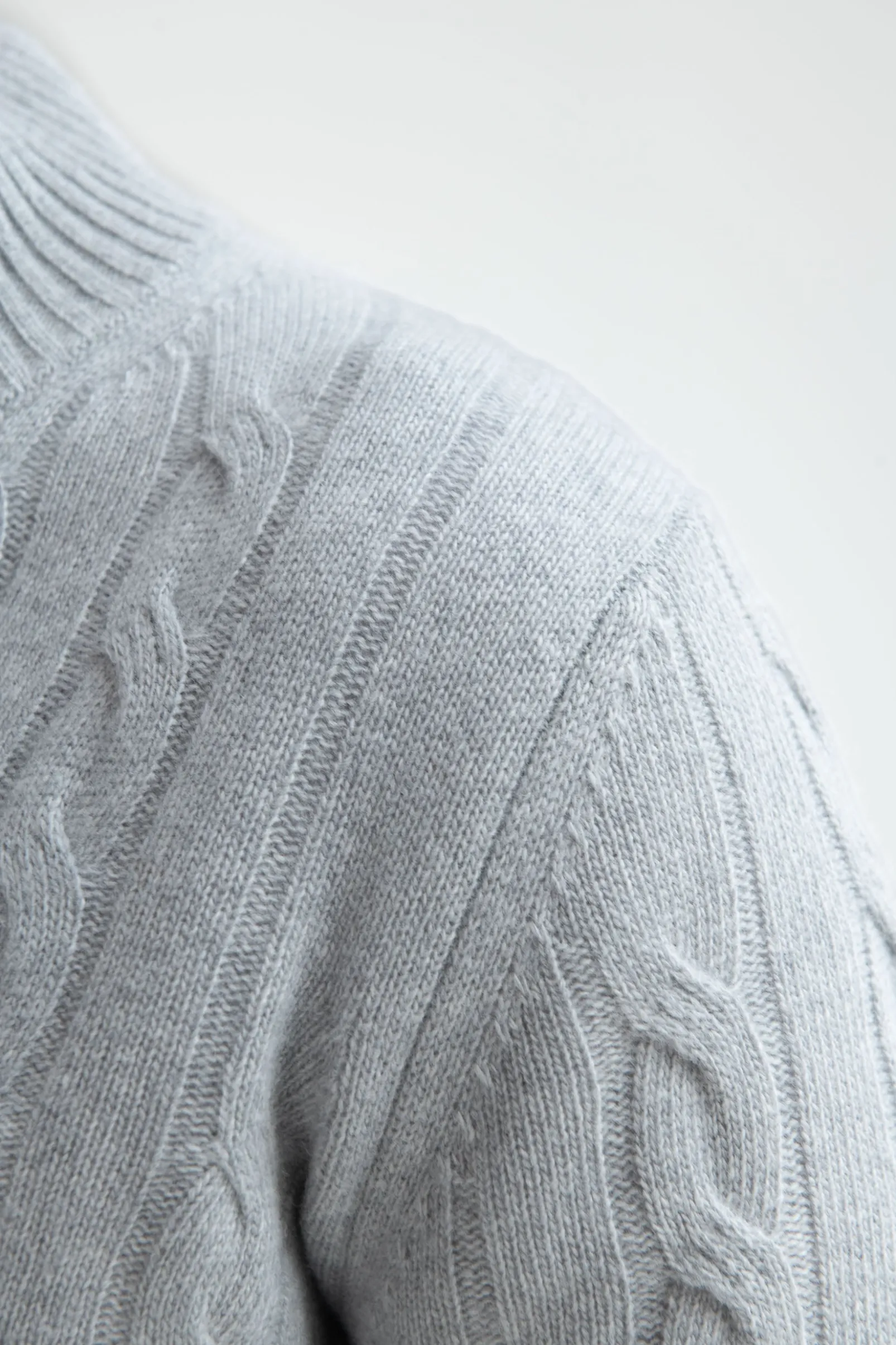 light_grey_cable_knit_car_3.webp Light grey cable knit cardigan – Made in Italy