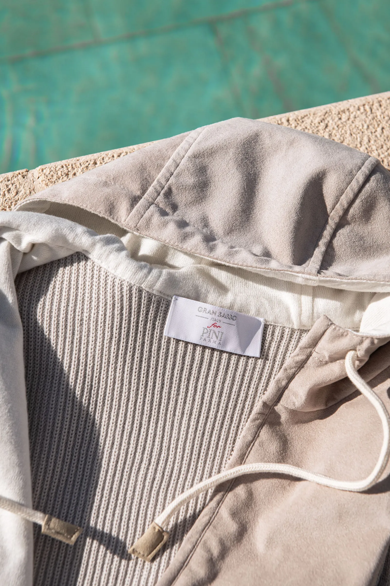 sand_alcantara_hooded_ves_4.webp Sand alcantara hooded vest – Made in Italy