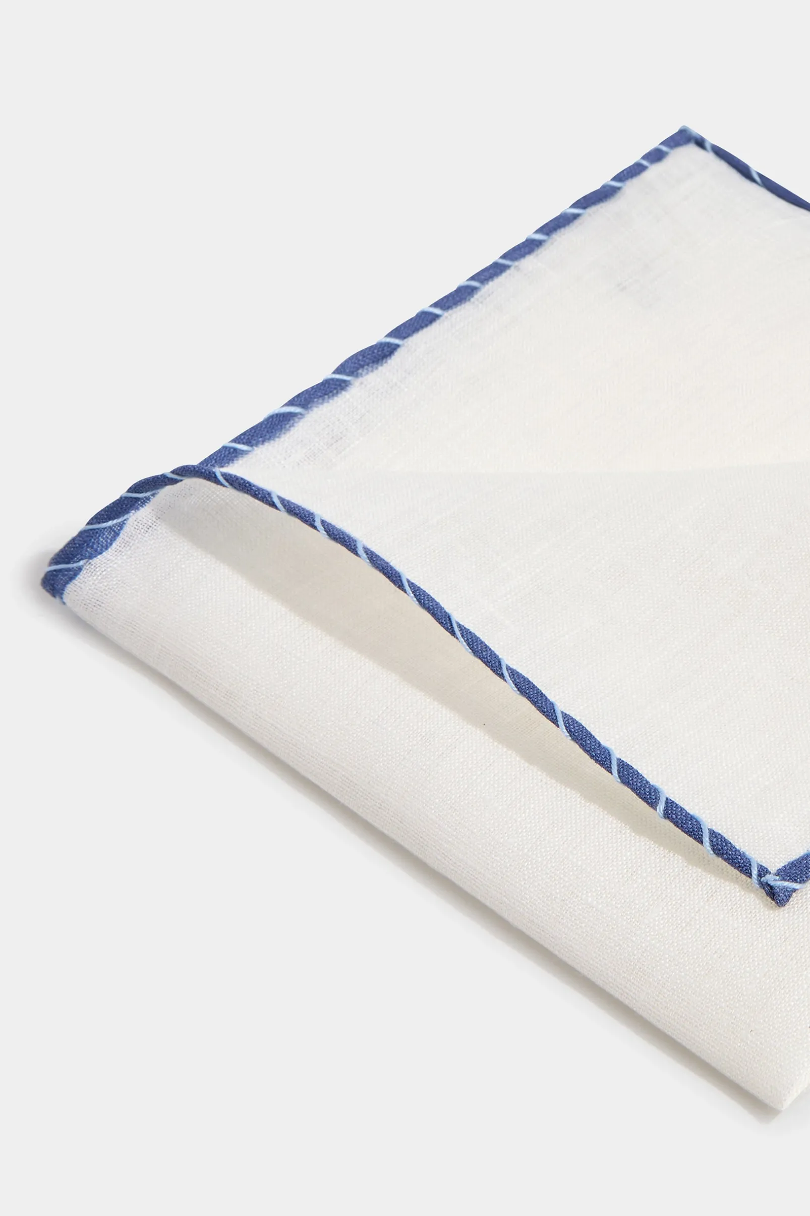 white_linen_pocket_square_1-3.webp White linen pocket square with blue and light blue edges - Made in Italy